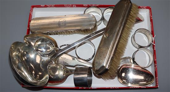 Five silver napkin rings, a Danish white metal spoon, two silver mounted brushes and minor plated flatware